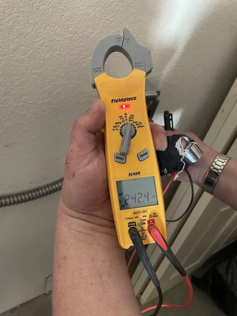 Voltage testing with clamp meter during Ceiling Fan Installation in Tupper Lake